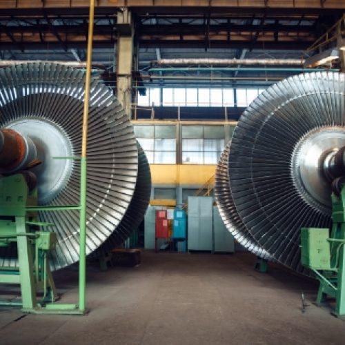 Impellers with vanes on turbine factory, nobody Impellers with vanes on turbine factory, nobody. Power machines manufacturing industry, plant interior on background, industrial machinery